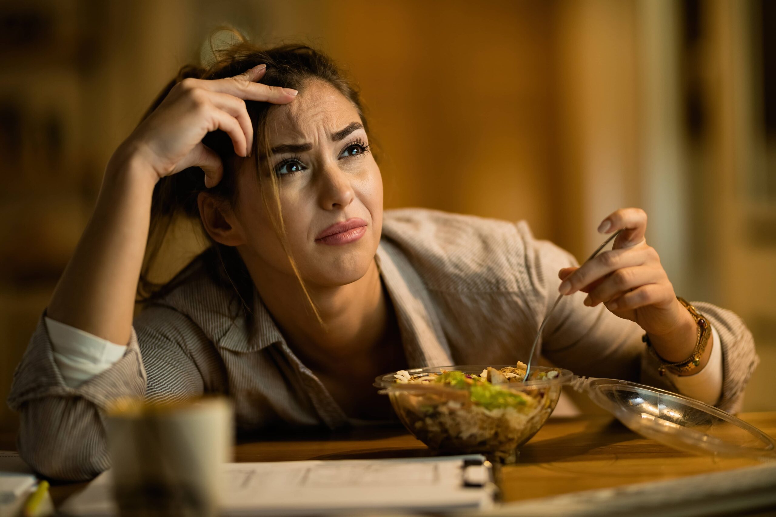 young distraught woman working late on a computer 2023 11 27 05 09 22 utc scaled